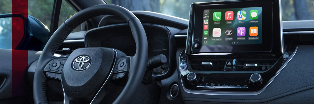 Toyota Corolla steering wheel and multimedia touchscreen.